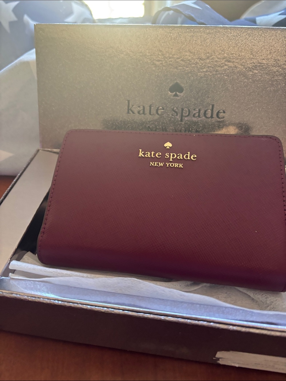kate spade burgundy and gold zip-around wallet